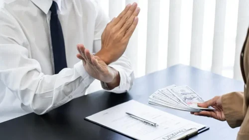 midsection-man-holding-hands-table_1048944-22541167